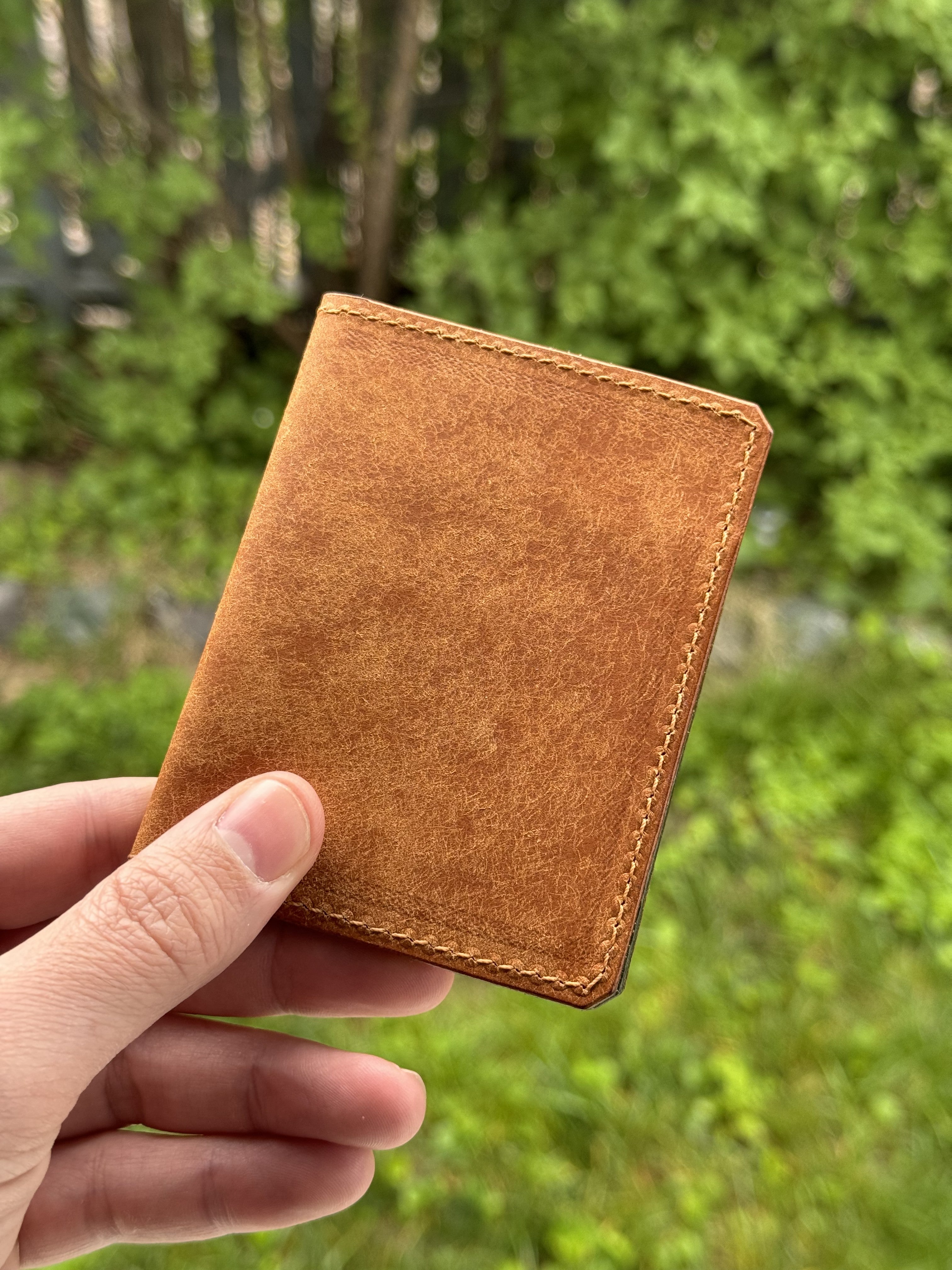 Cevanto tan on green leather wallet front view